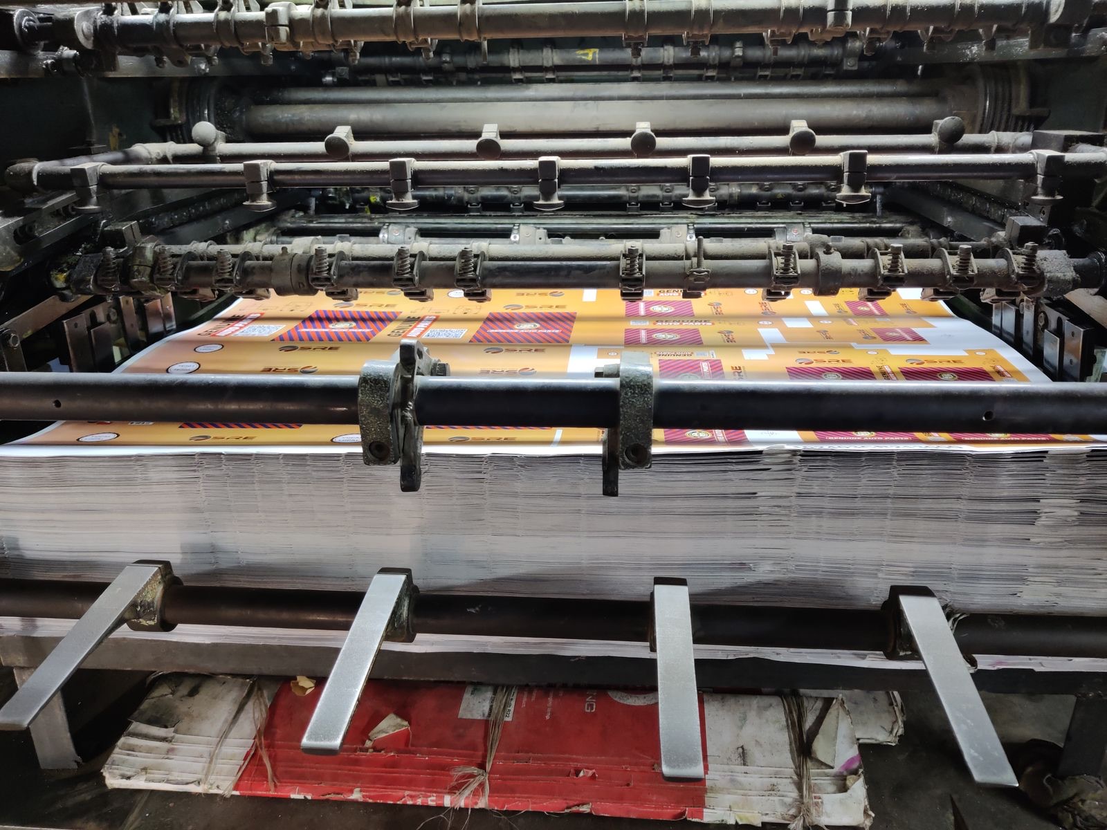 Industrial printing press running color sheets