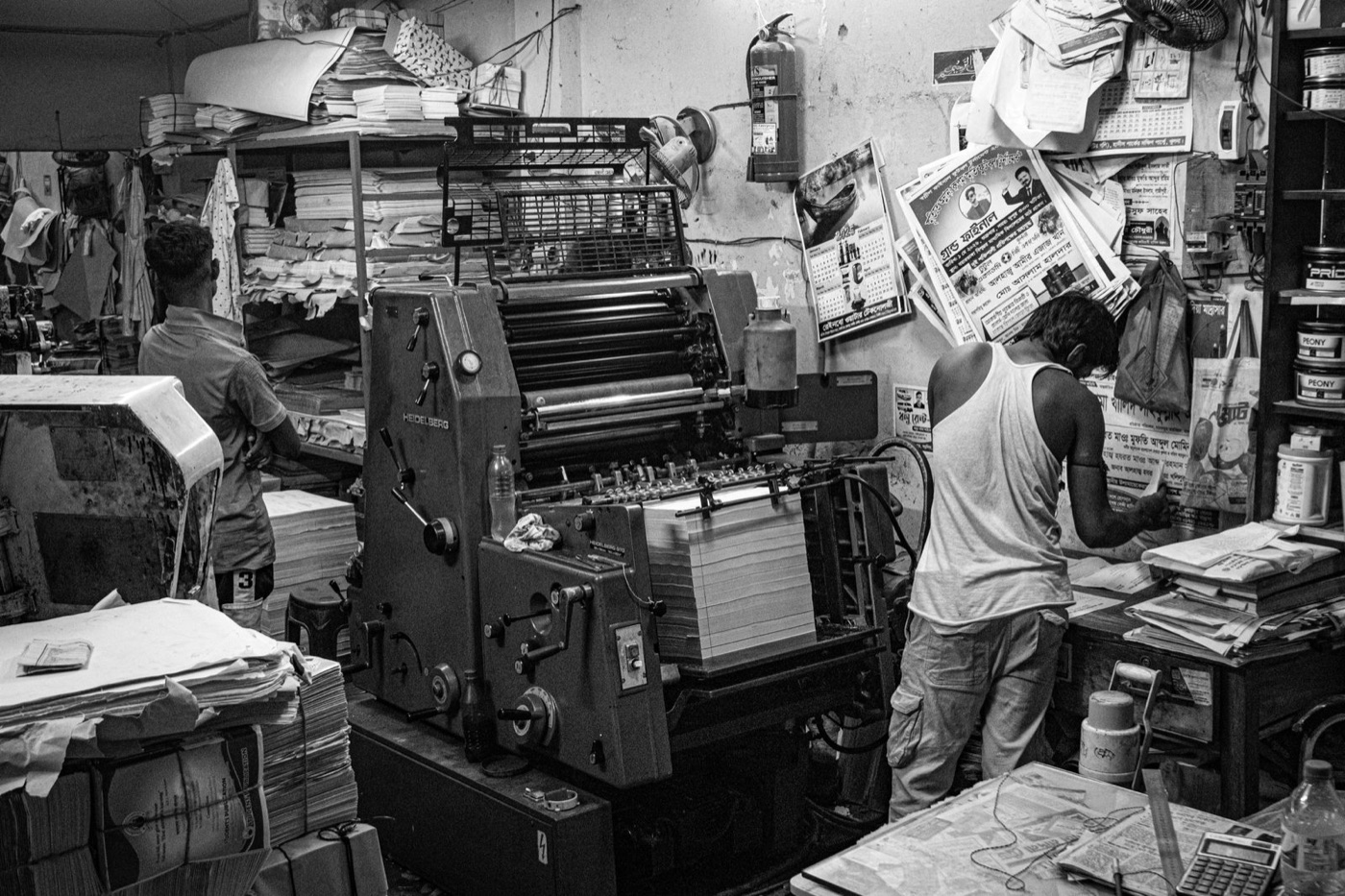 Print shop with presses and workers