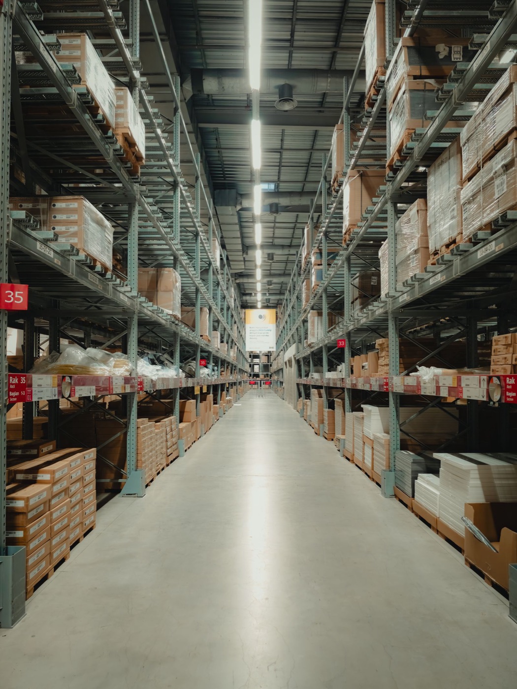 Warehouse aisle with stocked pallets